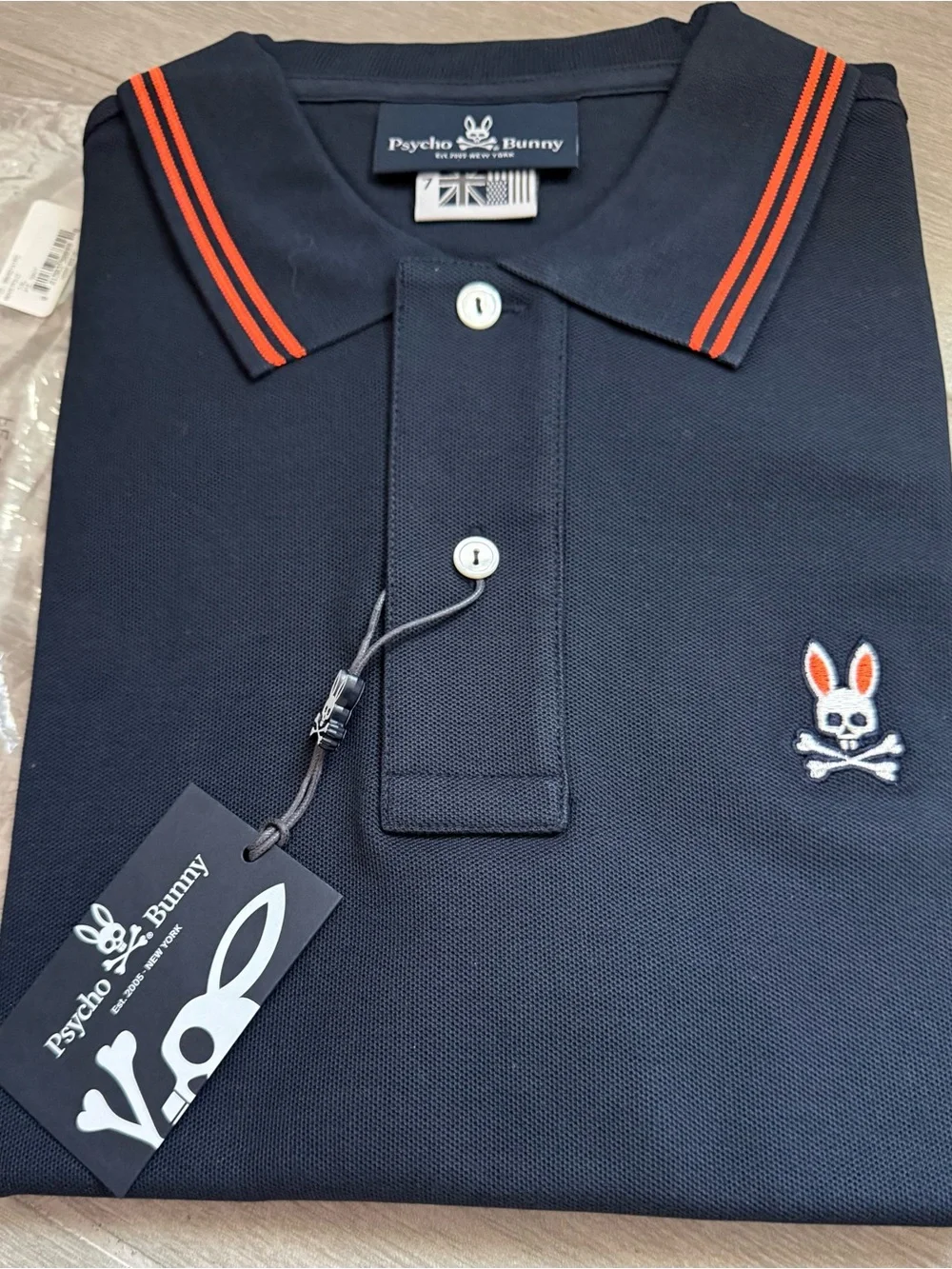BRAND NEW… in bag…Psycho Bunny Navy Polo with Orange Trim - Picture 2 of 3